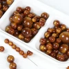 Chinese-style handcrafted beaded imitation wood, gilded silk nanmu, imitation cat's eye, silver-coated resin loose beaded accessories Item Picture